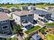 A bird's-eye view reveals the home's backyard, featuring a deck, patio, lush lawn, and mature landscaping at 18189 House Finch Ln, Parker, CO 80134