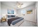 Cozy bedroom features a soft color palette, plush bedding, and wall art for a relaxing retreat at 18189 House Finch Ln, Parker, CO 80134