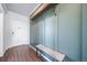 Charming entryway with hooks, shelf, and bench that offers a spot to hang coats and store essentials at 18189 House Finch Ln, Parker, CO 80134