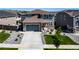 Beautiful two-story home with a well-kept lawn, showcasing a blend of modern design and comfortable living at 18189 House Finch Ln, Parker, CO 80134