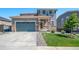 Charming two-story home with a well-manicured lawn and a two-car garage for comfortable suburban living at 18189 House Finch Ln, Parker, CO 80134