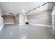 Spacious three car garage with epoxy floors and overhead lighting for all your storage and parking needs at 18189 House Finch Ln, Parker, CO 80134