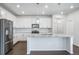Bright kitchen with stainless steel appliances, granite countertops, and a center island for food preparation at 18189 House Finch Ln, Parker, CO 80134