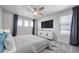 Relaxing main bedroom featuring a ceiling fan, soft carpet, and a dresser with drawers at 18189 House Finch Ln, Parker, CO 80134