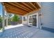 Covered patio with a concrete floor provides shade for outdoor dining and relaxation at 18189 House Finch Ln, Parker, CO 80134