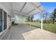 Covered back patio with an aluminum pergola overlooking a spacious, grassy backyard at 1246 S Routt Way, Lakewood, CO 80232