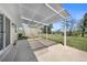 Covered back patio with an aluminum pergola overlooking a spacious, grassy backyard at 1246 S Routt Way, Lakewood, CO 80232