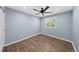 Bedroom featuring hardwood floors, a ceiling fan, and a window at 1246 S Routt Way, Lakewood, CO 80232