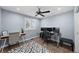 Bedroom area showcasing a ceiling fan, window with blinds, and wooden floors at 1246 S Routt Way, Lakewood, CO 80232
