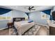 Bright bedroom with hardwood floors, a ceiling fan, and large windows at 1246 S Routt Way, Lakewood, CO 80232