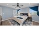 This is a well-lit bedroom with hardwood floors and a ceiling fan at 1246 S Routt Way, Lakewood, CO 80232