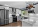Updated kitchen boasts stainless appliances, plenty of cabinet space and views of the backyard at 1246 S Routt Way, Lakewood, CO 80232