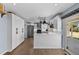 Eat-in kitchen with new cabinets, countertops, stainless appliances and sliding door to the exterior at 1246 S Routt Way, Lakewood, CO 80232