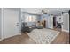 Stylish living room featuring hardwood floors, a patterned rug, and plenty of natural light at 1246 S Routt Way, Lakewood, CO 80232