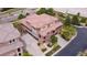 Aerial view of townhome with tile roof featuring attached garages and lush landscaping at 3491 Cascina Pl # D, Highlands Ranch, CO 80126