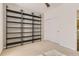 Bright bedroom featuring neutral carpet, ceiling fan, built-in shelving, and a closet at 3491 Cascina Pl # D, Highlands Ranch, CO 80126