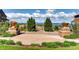 Picturesque community view from an elevated patio with lush landscaping and seating at 3491 Cascina Pl # D, Highlands Ranch, CO 80126