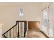 Entryway with stairs, storage cabinet, and natural light from the front door with blinds at 3491 Cascina Pl # D, Highlands Ranch, CO 80126