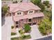 Beautiful two-story townhouse featuring a tile roof, brick accents, attached garages, and charming balconies at 3491 Cascina Pl # D, Highlands Ranch, CO 80126
