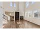 Sun-drenched living room with hardwood floors, large windows, high ceilings and fireplace at 3491 Cascina Pl # D, Highlands Ranch, CO 80126