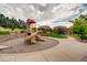 Community playground with slides and play equipment in a well-maintained area at 3491 Cascina Pl # D, Highlands Ranch, CO 80126