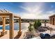Backyard features a covered pool with a deck, patio, well-manicured lawn and landscaping at 3491 Cascina Pl # D, Highlands Ranch, CO 80126