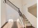 Elegant staircase with carpeted steps and decorative wrought iron railing at 3491 Cascina Pl # D, Highlands Ranch, CO 80126