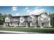 New construction townhomes with modern farmhouse architecture and manicured lawn at 14585 W 91St Ave # D, Arvada, CO 80005