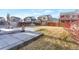 Backyard with a patio, with grass, shrubs and wooden fence at 13563 E 106Th Pl, Commerce City, CO 80022