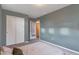 Bedroom with grey wall, closet, light-colored carpet, and neutral decor at 13563 E 106Th Pl, Commerce City, CO 80022