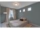 Airy bedroom featuring carpet, floor-to-ceiling curtains and well-lit windows at 13563 E 106Th Pl, Commerce City, CO 80022