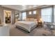 Spacious bedroom with neutral tones, large windows, walk-in closet, and plush carpeting at 13563 E 106Th Pl, Commerce City, CO 80022