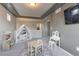 Versatile playroom area with space for various activities and views to the kitchen and beyond at 13563 E 106Th Pl, Commerce City, CO 80022