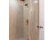 Tiled shower featuring a brass shower head, handle, and elegant tile work at 13563 E 106Th Pl, Commerce City, CO 80022