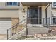 Inviting front entrance with decorative door and well-maintained steps and railing at 2269 S Yank Ct, Lakewood, CO 80228