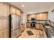 Modern kitchen features stainless steel appliances, granite countertops, and ample cabinet space at 2269 S Yank Ct, Lakewood, CO 80228