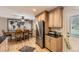 Open kitchen featuring granite countertops, stainless appliances, and adjacent dining area at 2269 S Yank Ct, Lakewood, CO 80228