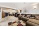 Spacious living area with comfortable seating, a rug, and natural light from windows at 2269 S Yank Ct, Lakewood, CO 80228