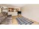 Cozy living area featuring hardwood floors, a neutral paint palette, and an open view to the kitchen at 2269 S Yank Ct, Lakewood, CO 80228