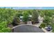 Aerial view of the home and mature trees, circular driveway, and proximity to the neighborhood at 10718 Ash Ct, Thornton, CO 80233