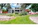 Expansive backyard featuring lush greenery, a shed and a multi-level deck for outdoor enjoyment at 10718 Ash Ct, Thornton, CO 80233