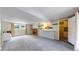 Finished basement with fireplace, bar, and bonus room featuring neutral carpet and paint and recessed lighting at 10718 Ash Ct, Thornton, CO 80233