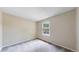 Bedroom featuring a window, carpeted floor, and neutral colored walls at 10718 Ash Ct, Thornton, CO 80233