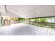 Expansive covered deck featuring gray painted wood flooring and railing offers serene outdoor space at 10718 Ash Ct, Thornton, CO 80233