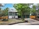 Well-maintained two-story home with lush landscaping and a spacious two-car garage at 10718 Ash Ct, Thornton, CO 80233