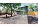 Charming two-story home with lush green lawn, beautiful landscaping, and a two car garage at 10718 Ash Ct, Thornton, CO 80233