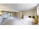 Living room featuring carpet, sliding glass doors to the outside patio, and a built-in daybed at 10718 Ash Ct, Thornton, CO 80233