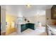 Modern kitchen and open concept living room with plenty of natural light at 10718 Ash Ct, Thornton, CO 80233
