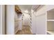 Spacious walk-in closet with custom shelving and ample storage space for clothes and accessories at 10718 Ash Ct, Thornton, CO 80233
