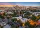 Stunning aerial view of a residential neighborhood with the city skyline, highlighting urban living at 3220 Zuni St, Denver, CO 80211